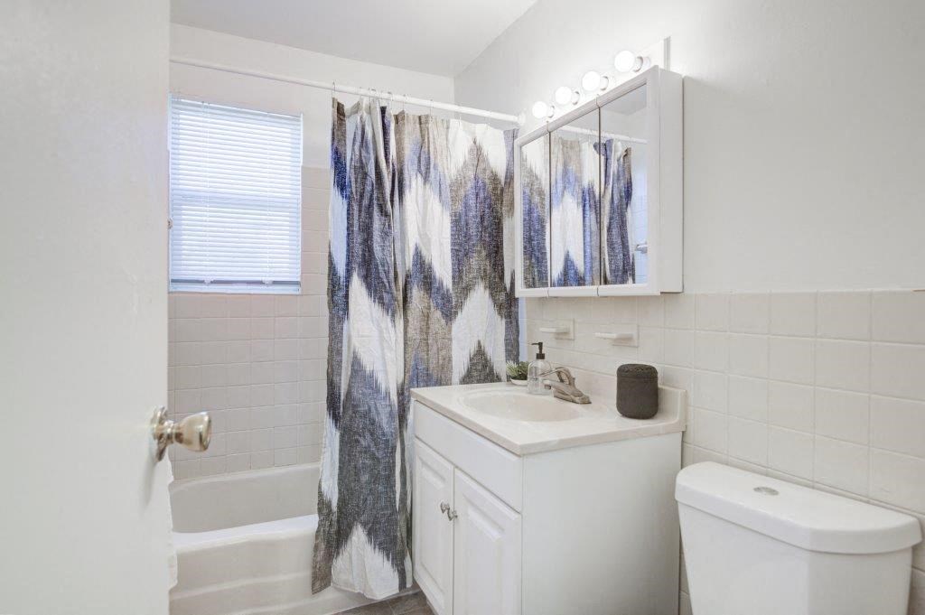 a bathroom with a sink toilet and a shower