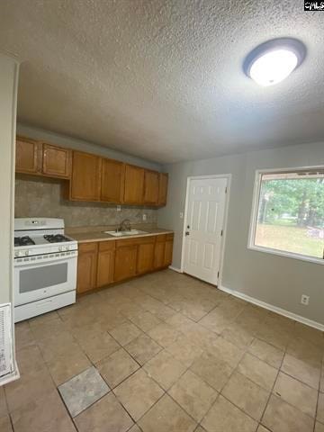 A kitchen with white appliances and wooden cabinets.