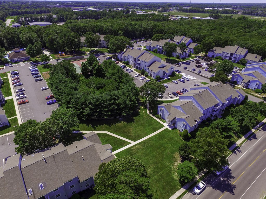 an aerial view of a neighborhood with houses and cars parked