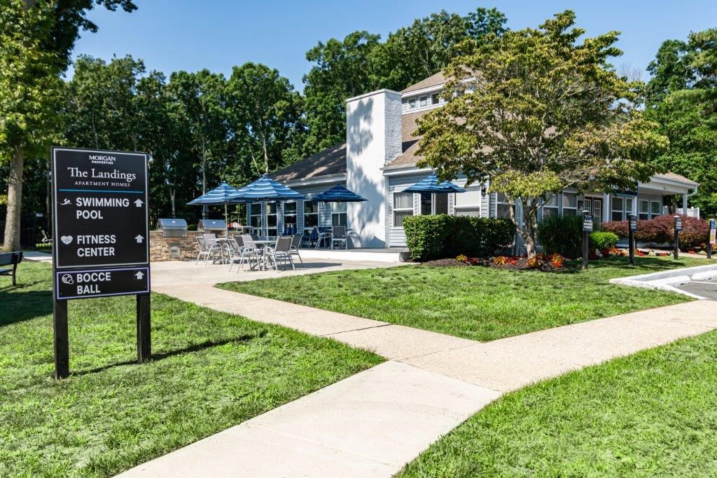 the landing apartments sign in front of the leasing office