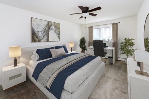 a bedroom with a bed and a ceiling fan