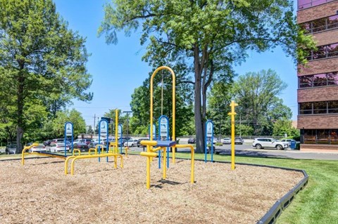 a playground in a park next to a building