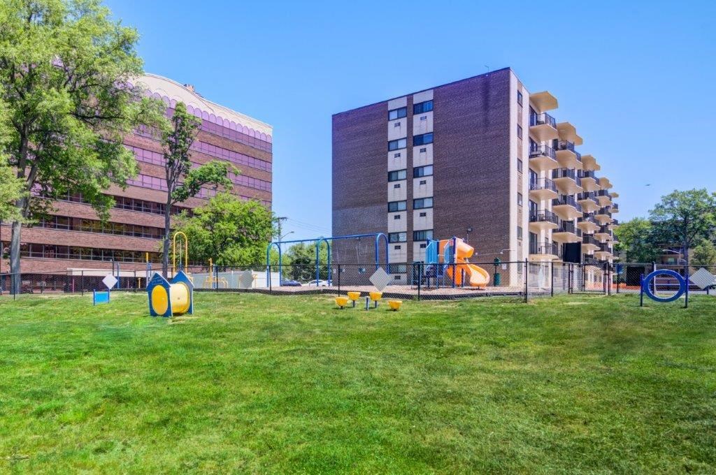 a playground in a park next to some buildings