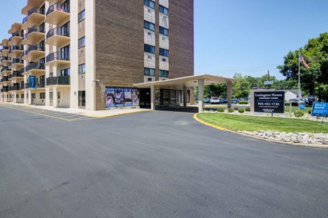 the building where the hotel is located is a large building with a sign in front