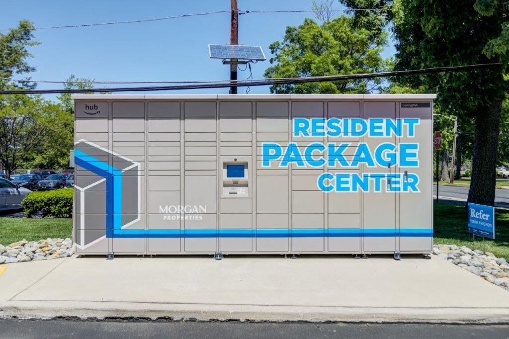 a sign for theresident package center on the side of a building