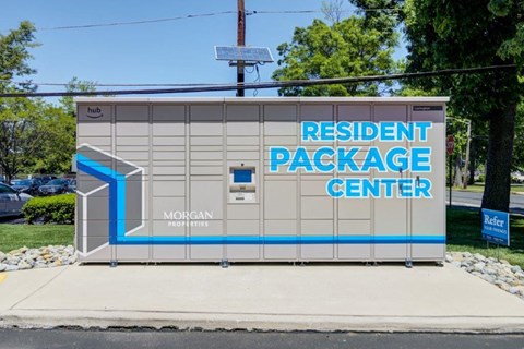 a sign for theresident package center on the side of a building