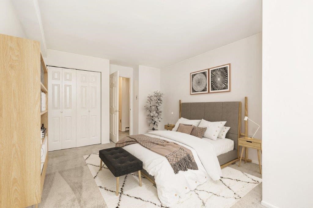 a bedroom with a bed and a closet