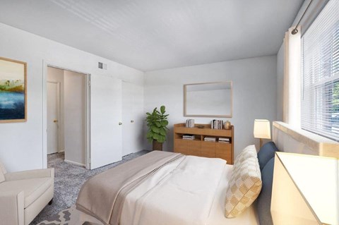 a bedroom with a bed and a couch