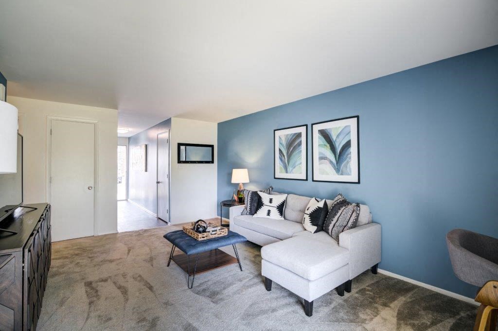 a living room with a blue wall and a couch