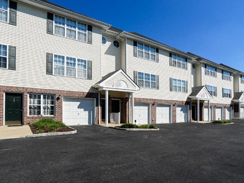 a large white building with a garage door