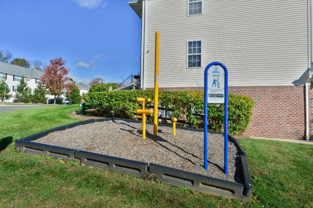 a childrens playground in front of a house