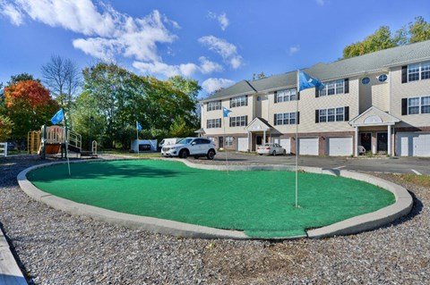 a putting green in front of a building