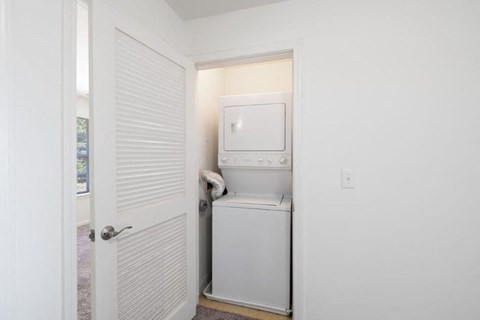 a small laundry room with a washer and dryer in it