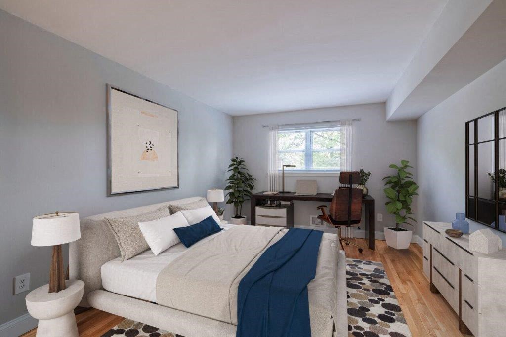 a living room with a couch and a bed