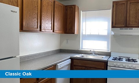 a kitchen with wooden cabinets and a white stove and a sink