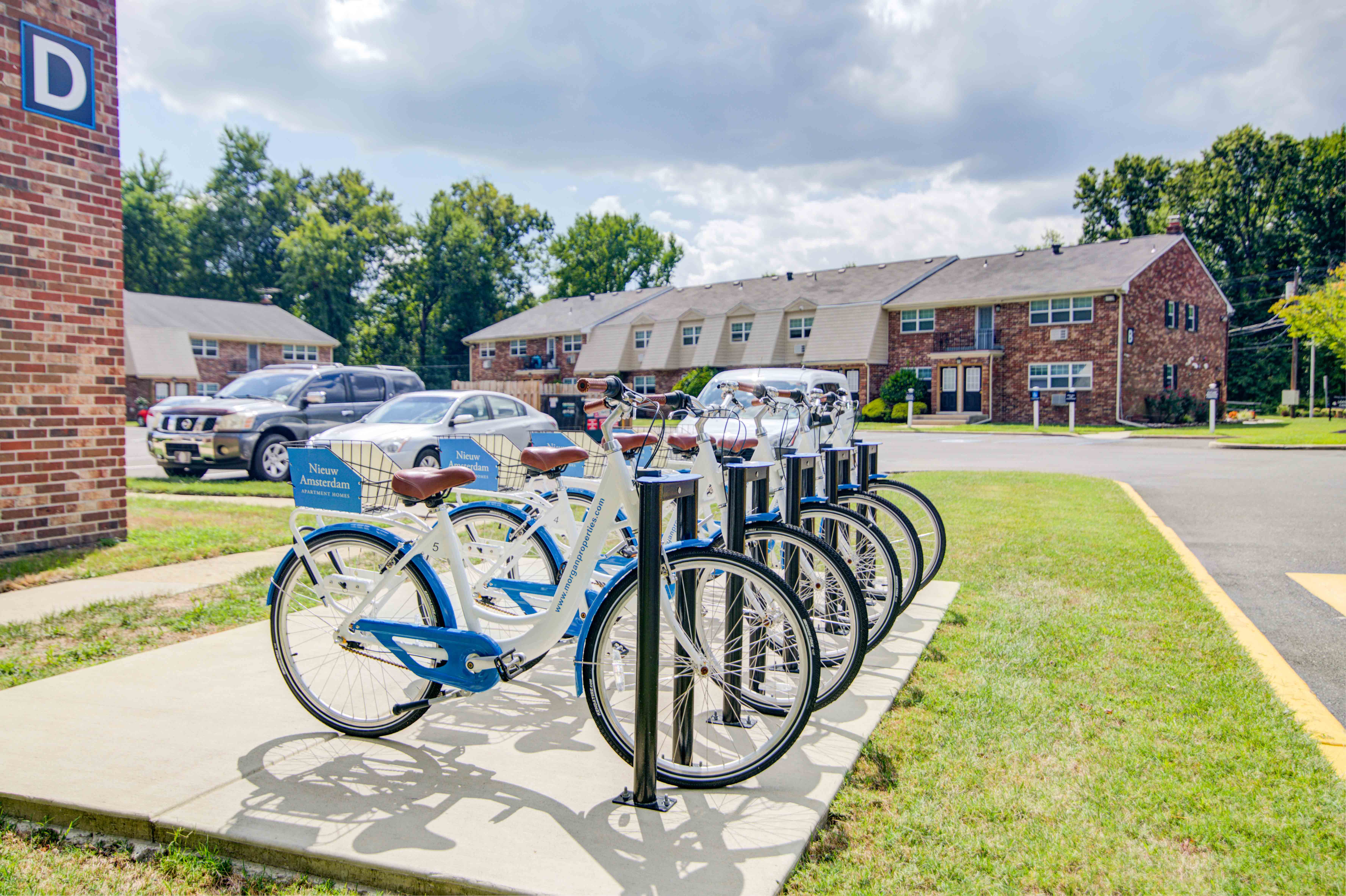 a row of bikes parked in front of a building