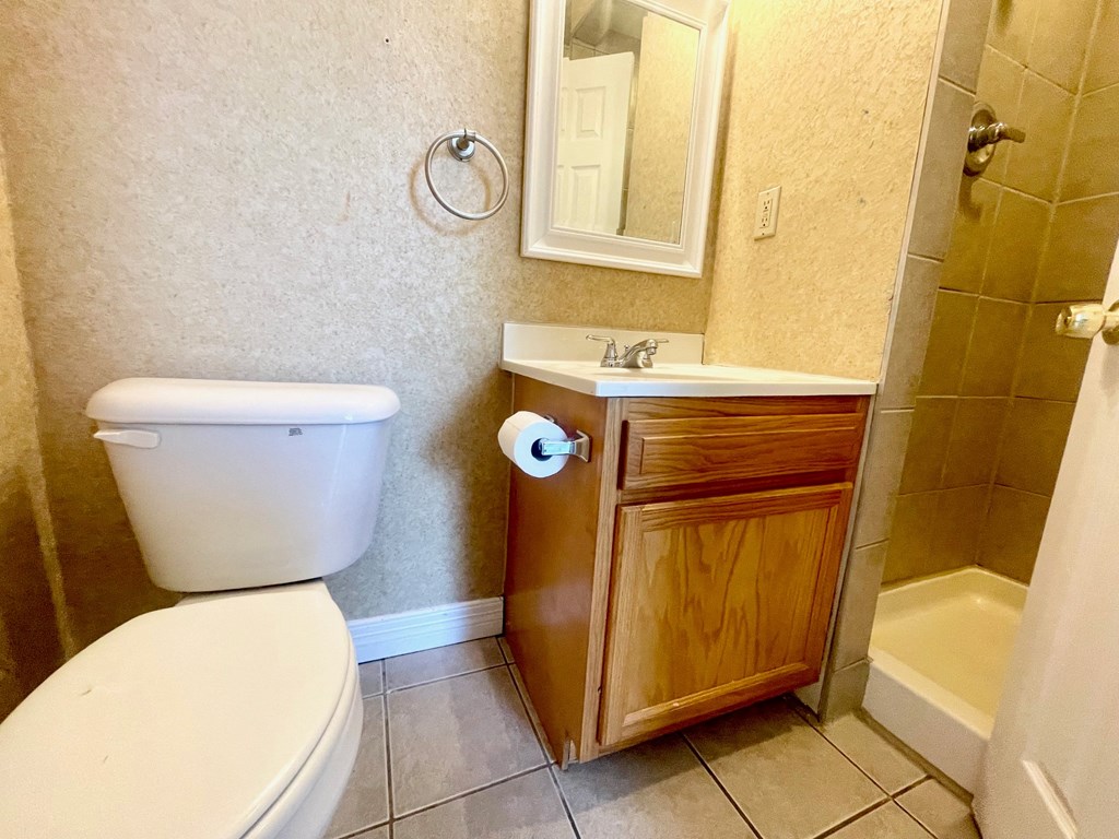 a bathroom with a toilet and a sink