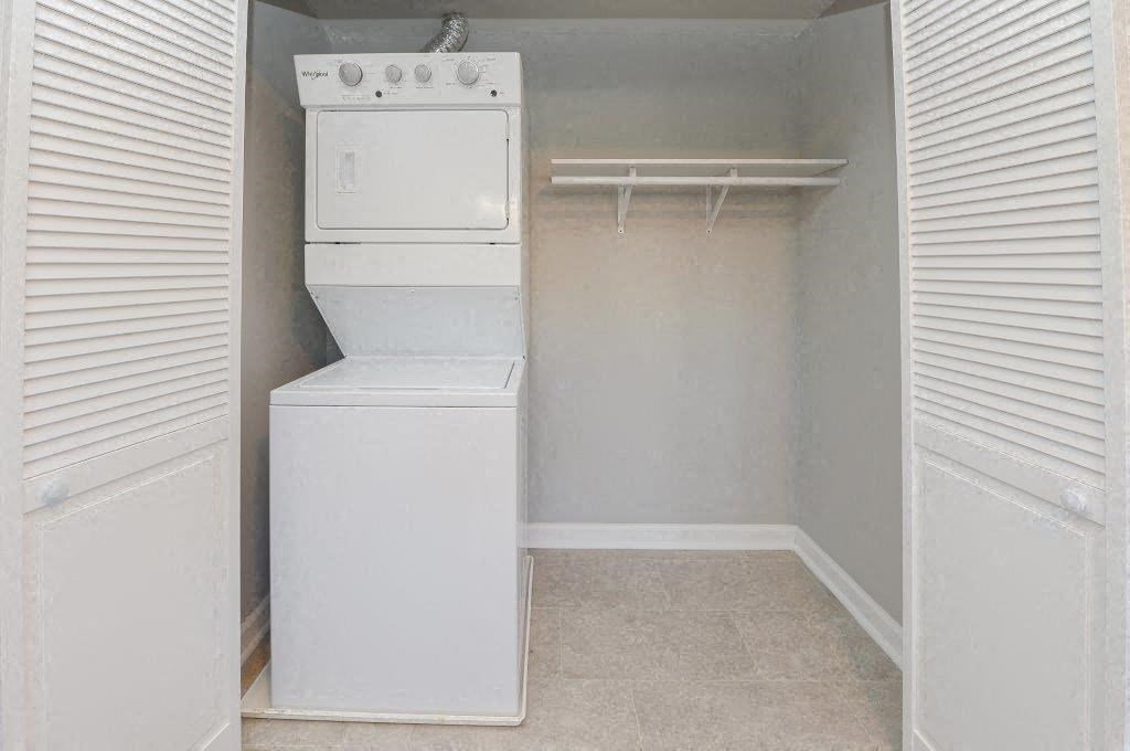 a laundry room with a washer and dryer in it