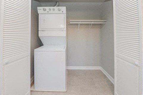 a laundry room with a washer and dryer in it