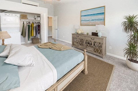 a bedroom with a bed and a dresser