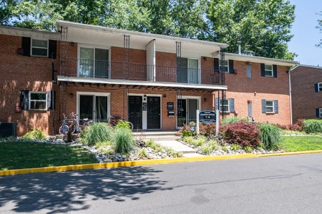 the front of a brick building with two bikes in front