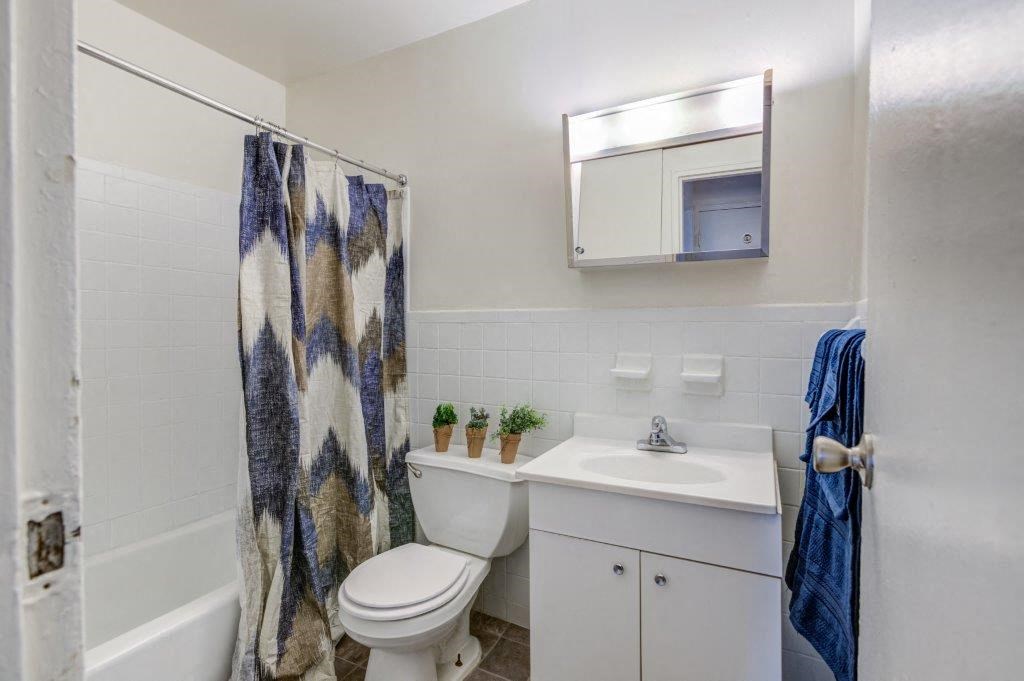 a bathroom with a sink toilet and a shower