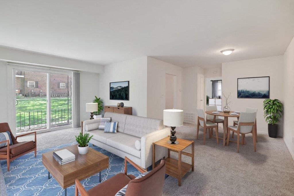 a living room and dining room with a couch and a table