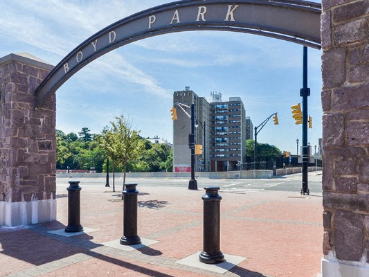 a view of a city street from under an arch