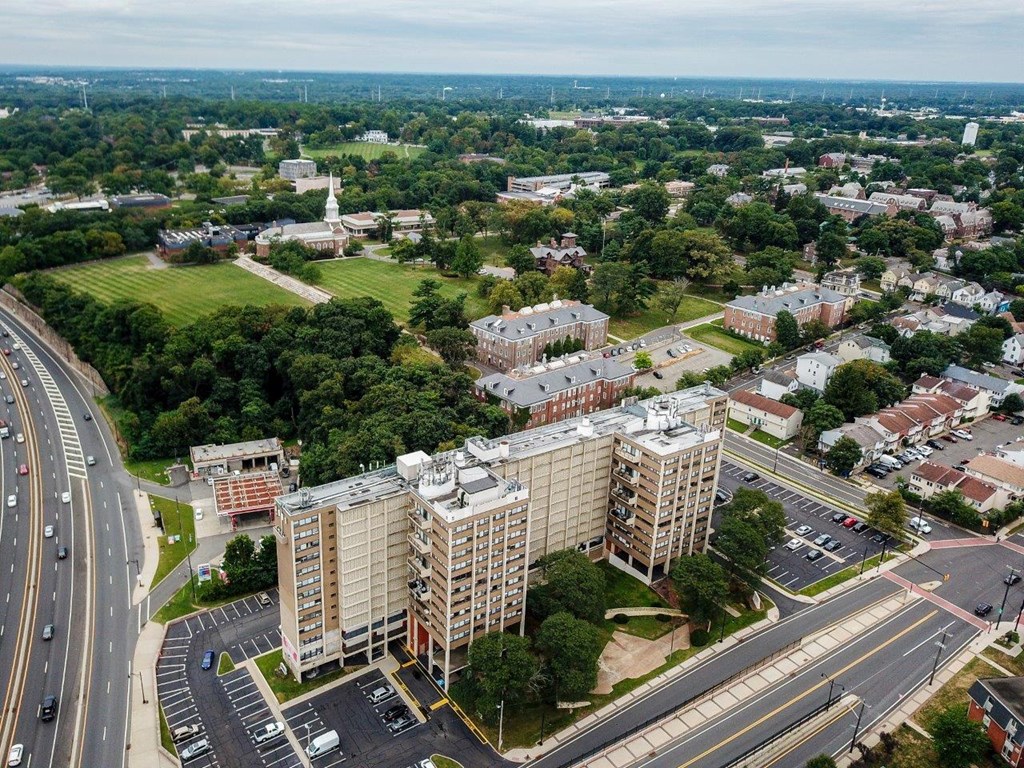 an aerial view of a city with tall buildings and a highway