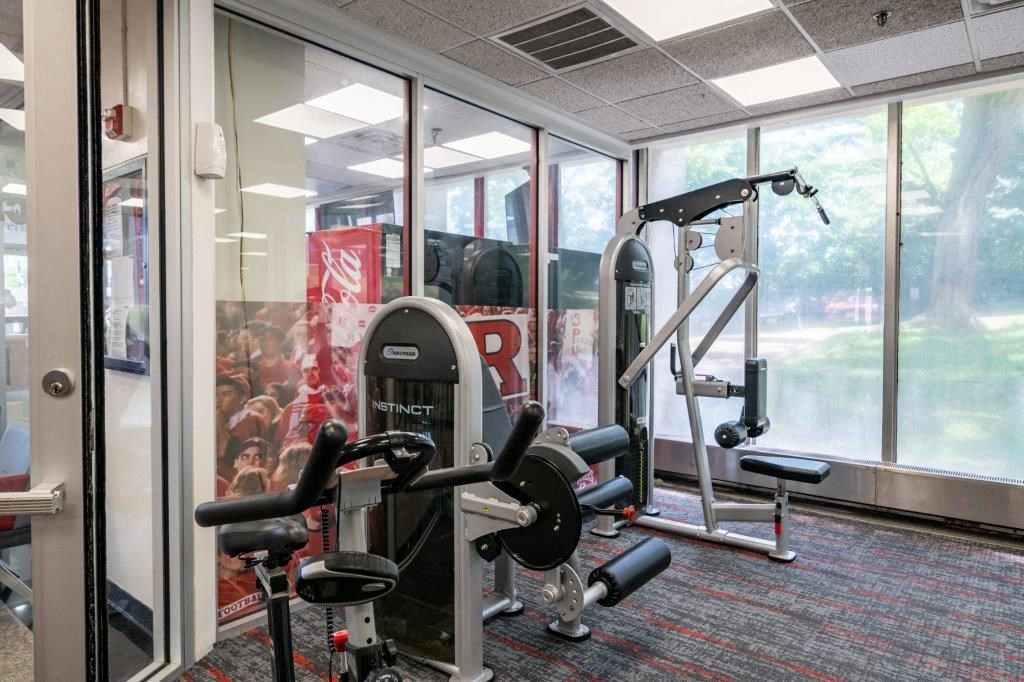 the gym has a lot of equipment in it