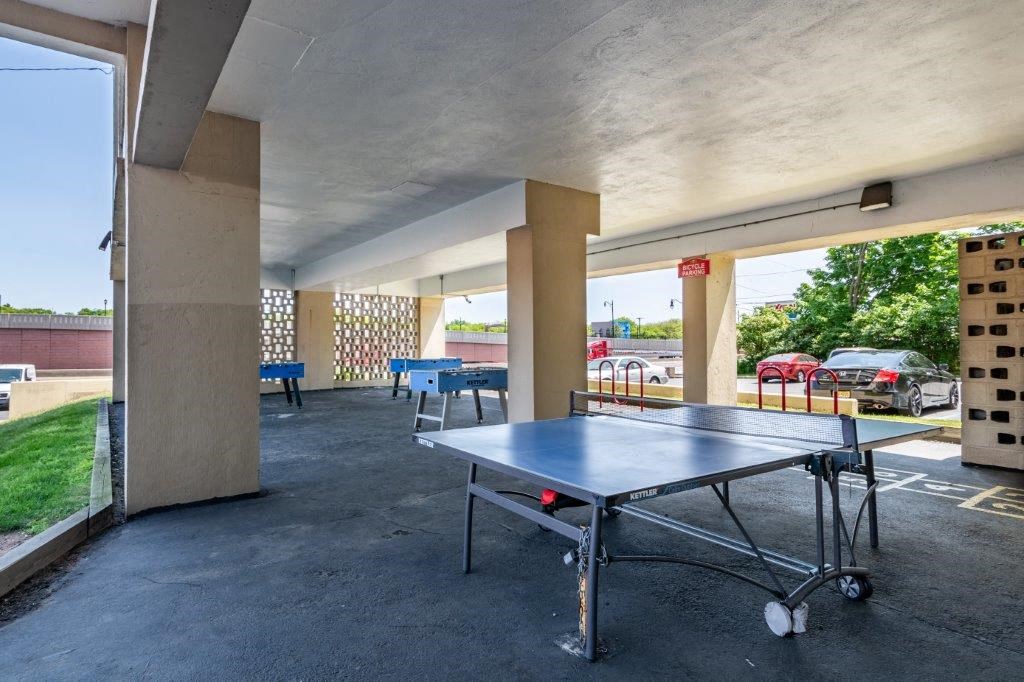 a ping pong table on the patio of a building