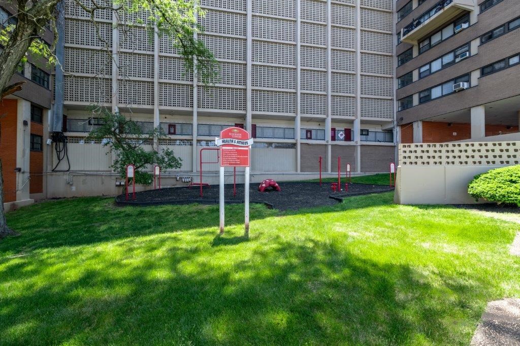 a no parking sign in front of an apartment building