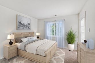 a bedroom with a bed and a window