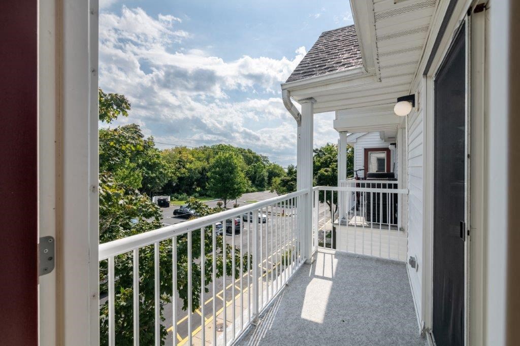 a view from the balcony of a white house
