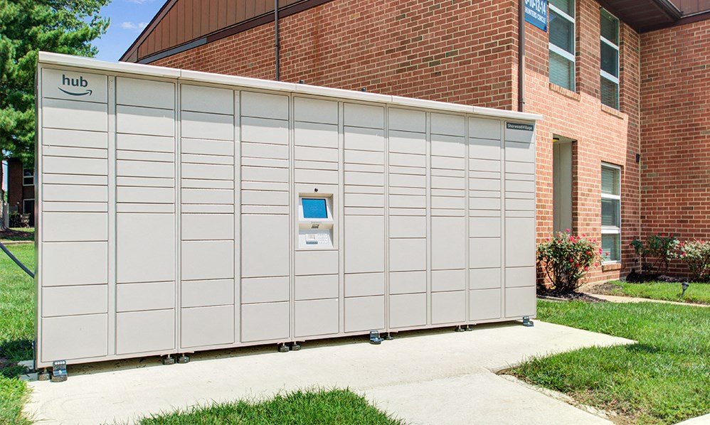 a large white storage unit in front of a brick building