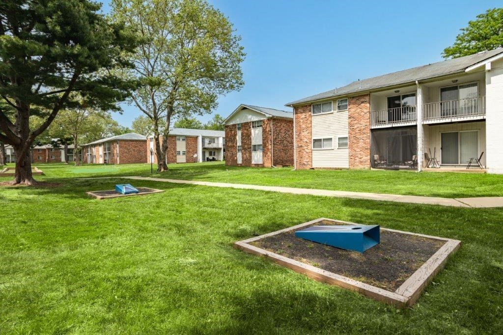 our apartments have an outdoor area with grass and trees