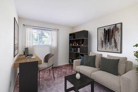 a living room with a couch and a desk