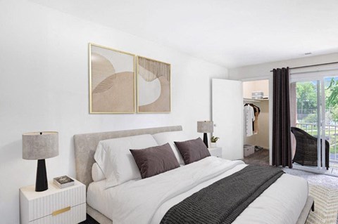 a bedroom with a large bed and a window