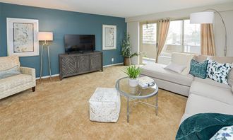 a living room with blue walls and a white couch