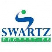 The image is a logo of a company named Swartz Properties.