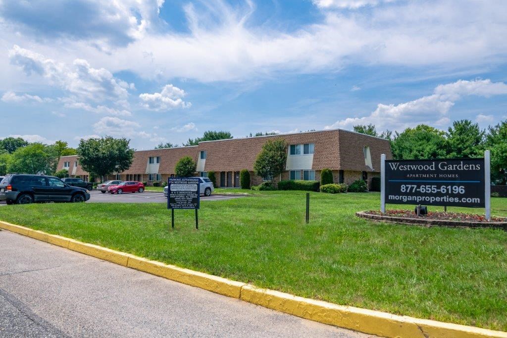 a building with a street sign in front of it