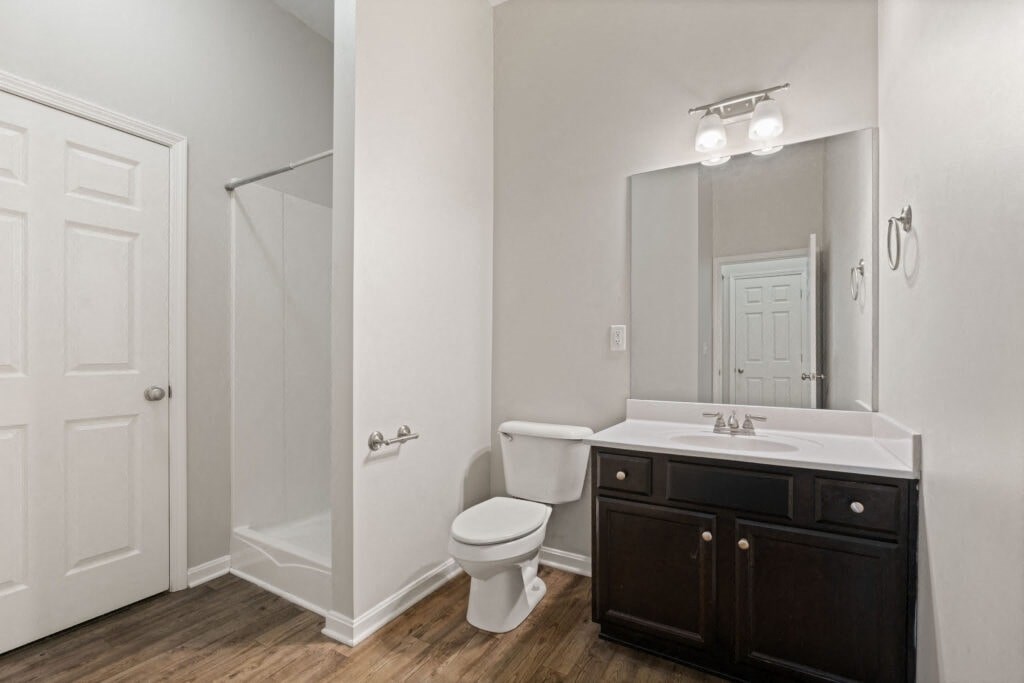 a bathroom with a sink toilet and a shower