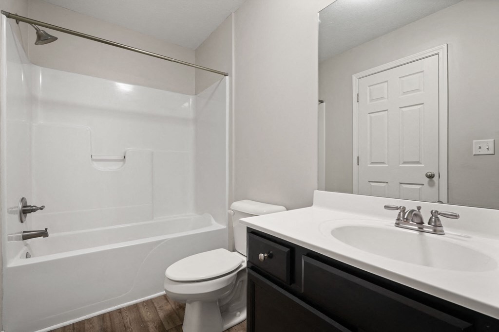 the preserve at ballantyne commons apartment bathroom with sink toilet and shower