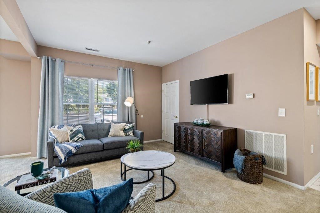 a living room with a couch and a tv