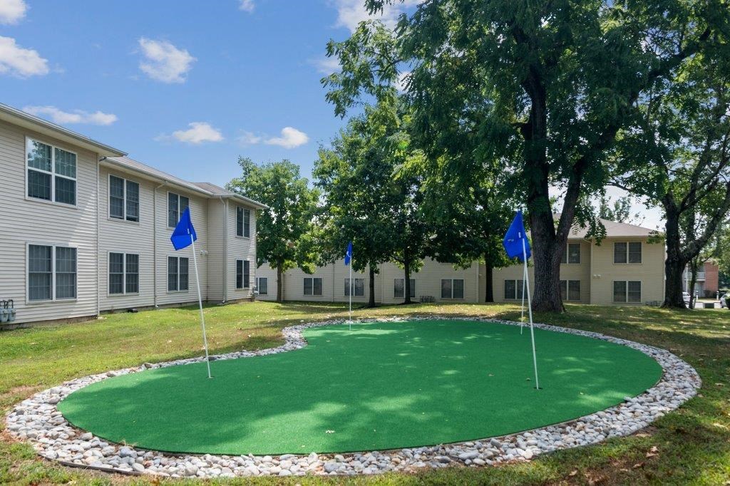 our apartments have a putting green and blue flags
