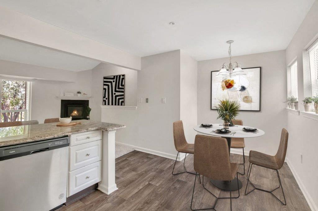 Dining nook next to kitchen with round table and four chairs