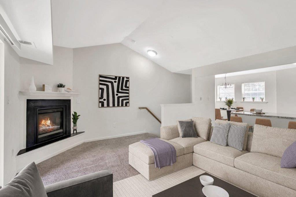 a living room with a couch and a fireplace