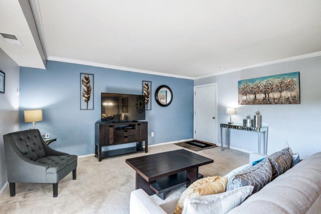 a living room with a couch and a table