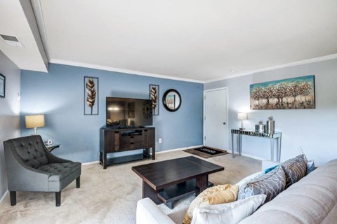 a living room with a couch and a table