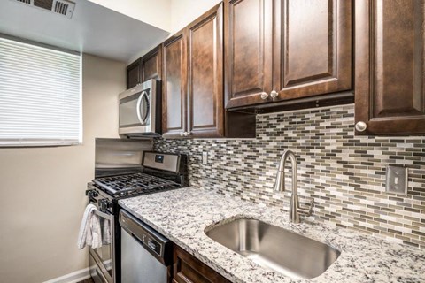 a kitchen with a sink and a microwave